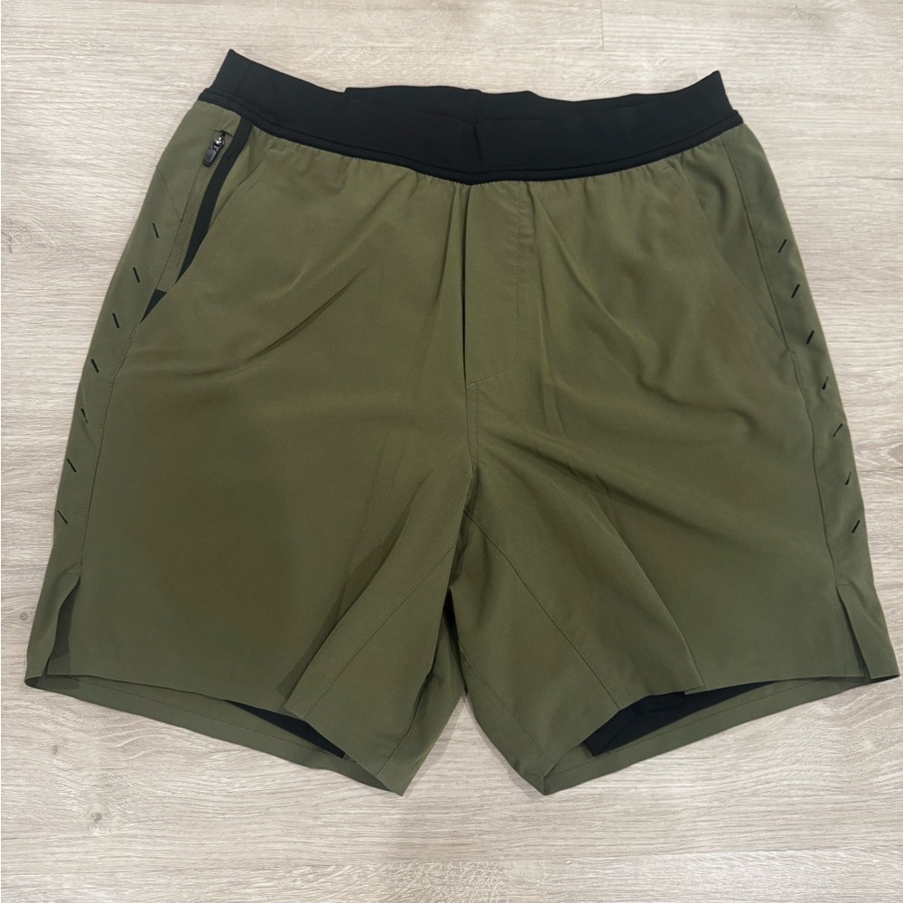 Ten Thousand Interval 7” short with liner, size medium, excellent condition.
